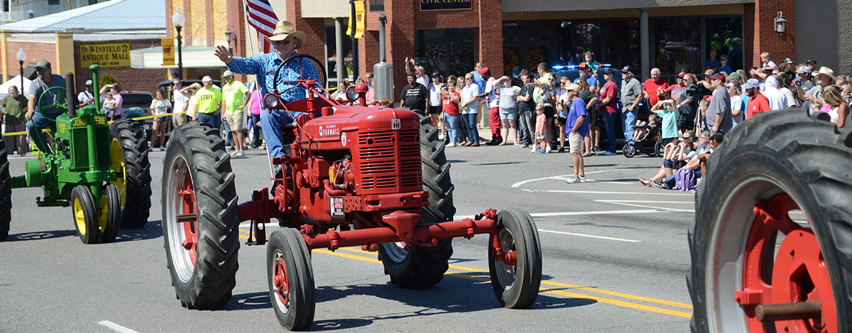 Mule Day 2022 - Antique tractors rolling through town!